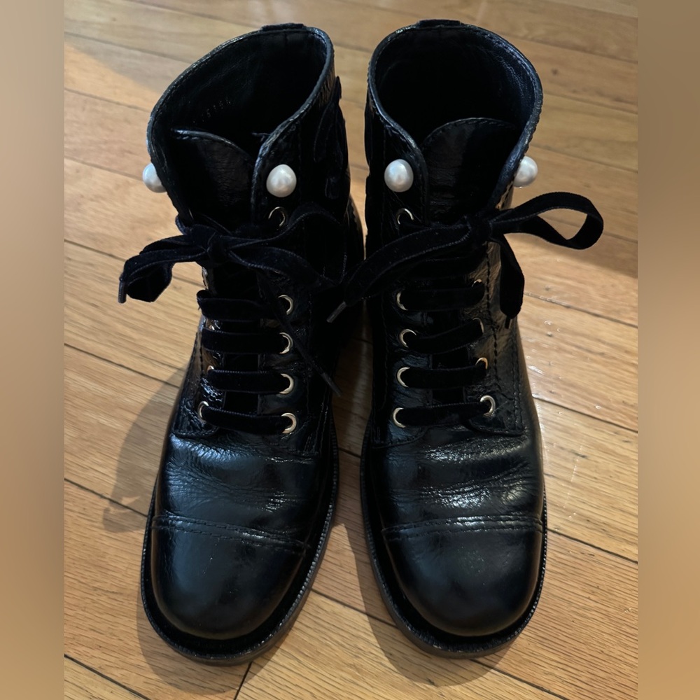 Chanel classic black patten lace up combat boot.